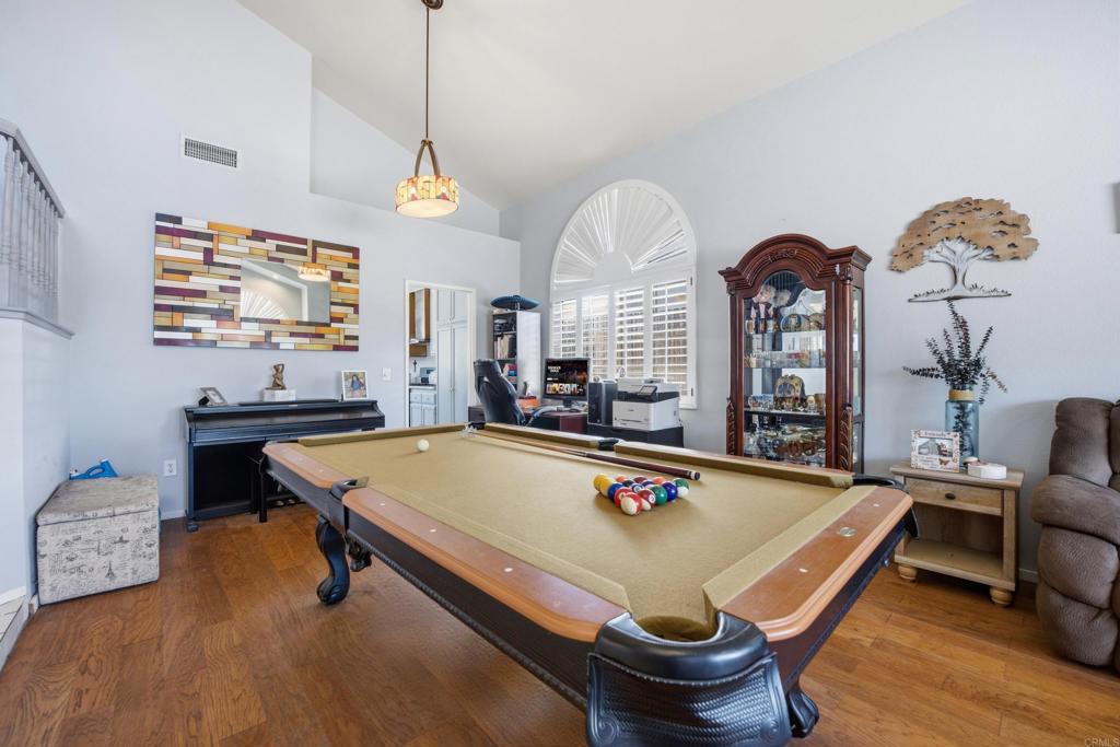 2077 Westwood Road Vista, CA 92083 - Photo 7 of 37 a room with furniture pool table and windows
