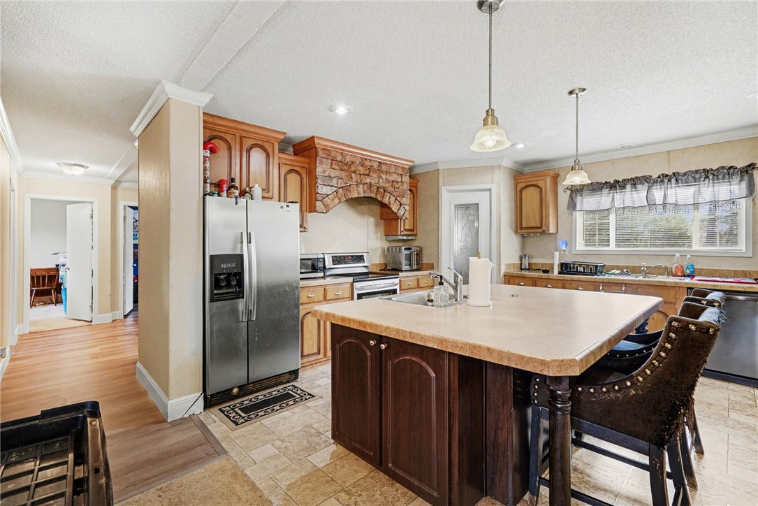 1004 Chapman Road Honea Path, SC 29654 - Photo 12 of 30 This spacious kitchen features a large island and ample cabinet space.