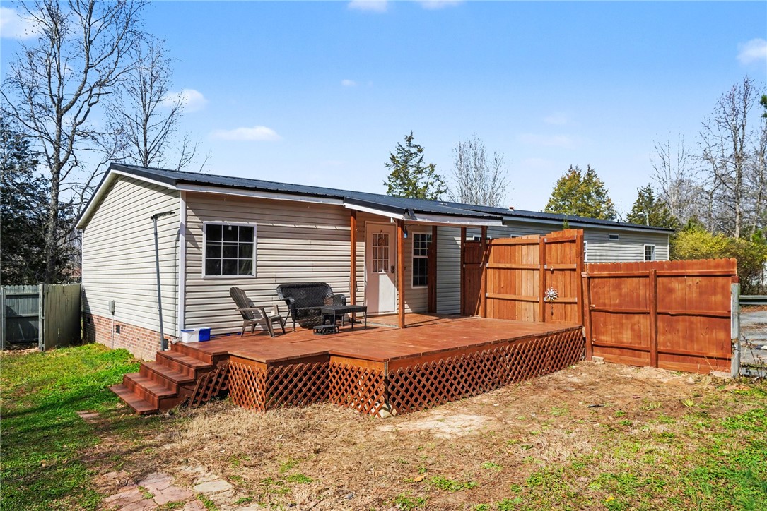 1004 Chapman Road Honea Path, SC 29654 - Photo 27 of 30 This charming home offers a spacious deck perfect for outdoor enjoyment and entertaining.