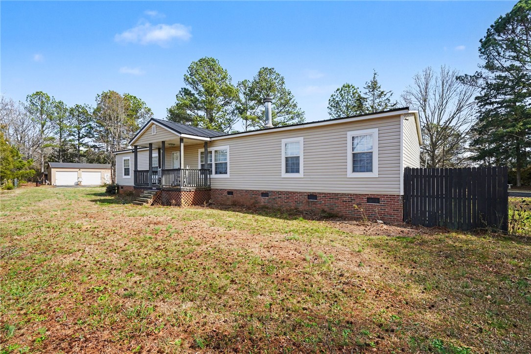 1004 Chapman Road Honea Path, SC 29654 - Photo 3 of 30 This charming residence features a classic front porch and an expansive, verdant yard.