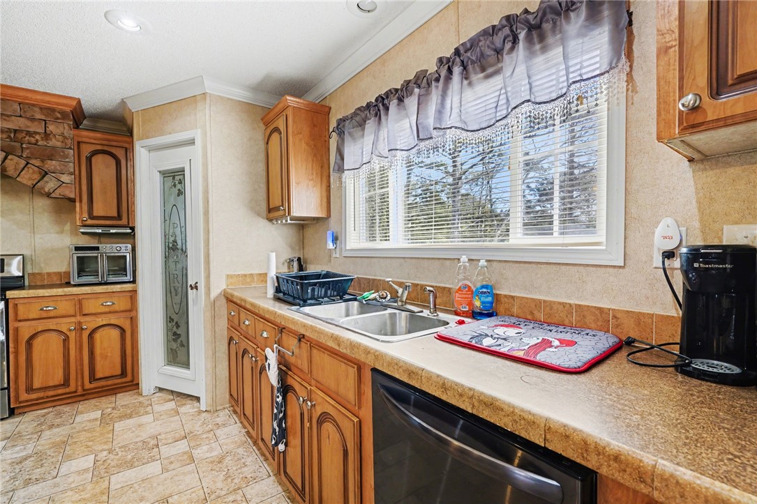 1004 Chapman Road Honea Path, SC 29654 - Photo 6 of 30 This bright kitchen features ample counter space and classic cabinetry, ideal for everyday living.