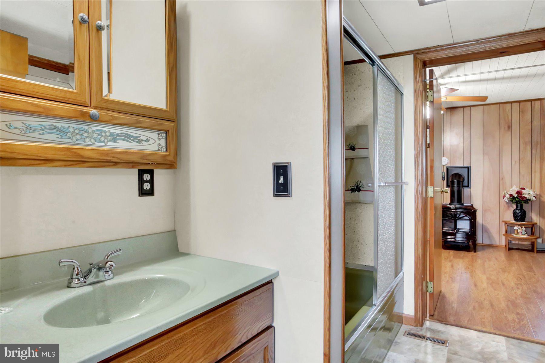 72 Cedar Grove Road Mifflintown, PA 17059 - Photo 21 of 31 a bathroom with a sink and a mirror