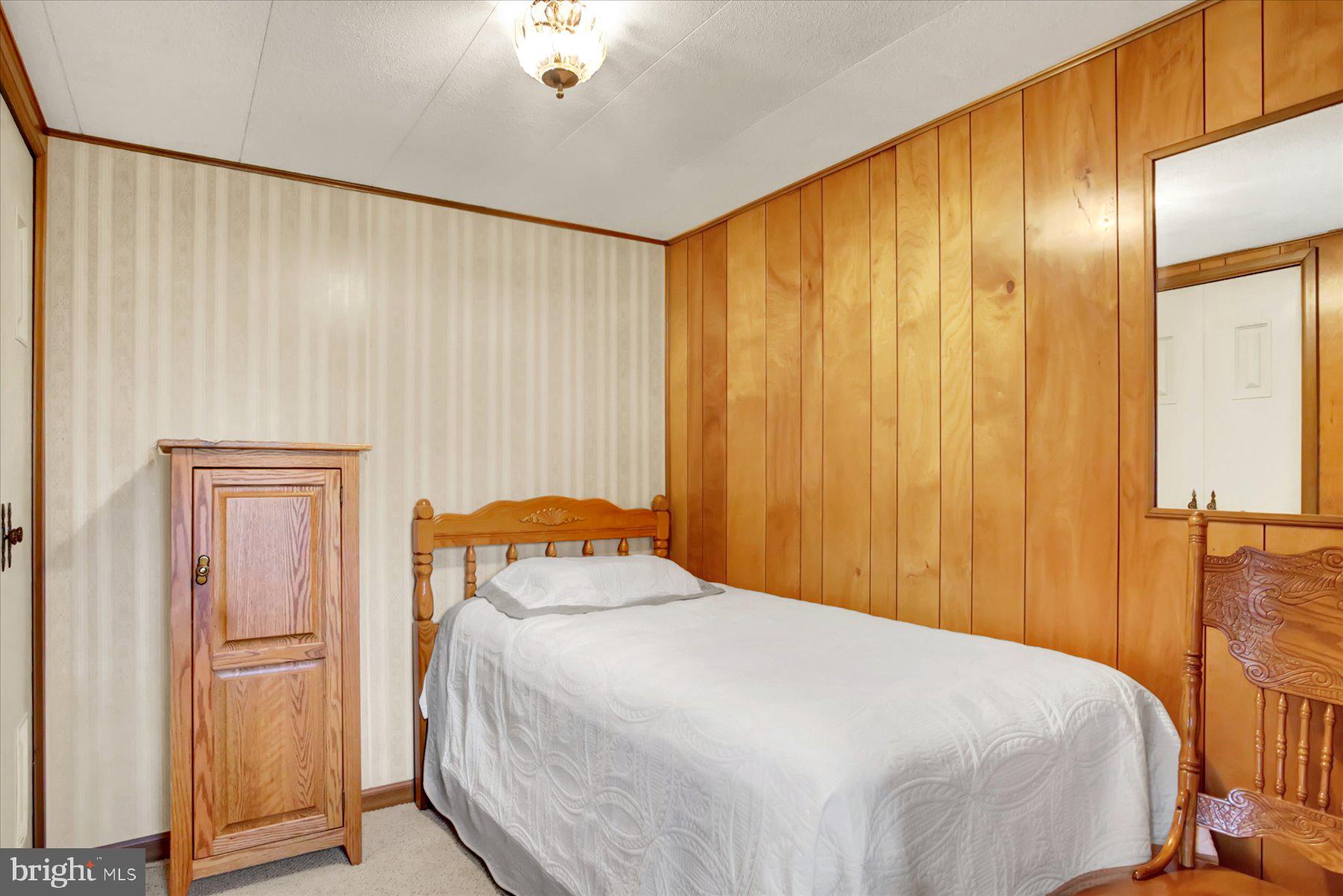 72 Cedar Grove Road Mifflintown, PA 17059 - Photo 22 of 31 a bedroom with a bed and a window