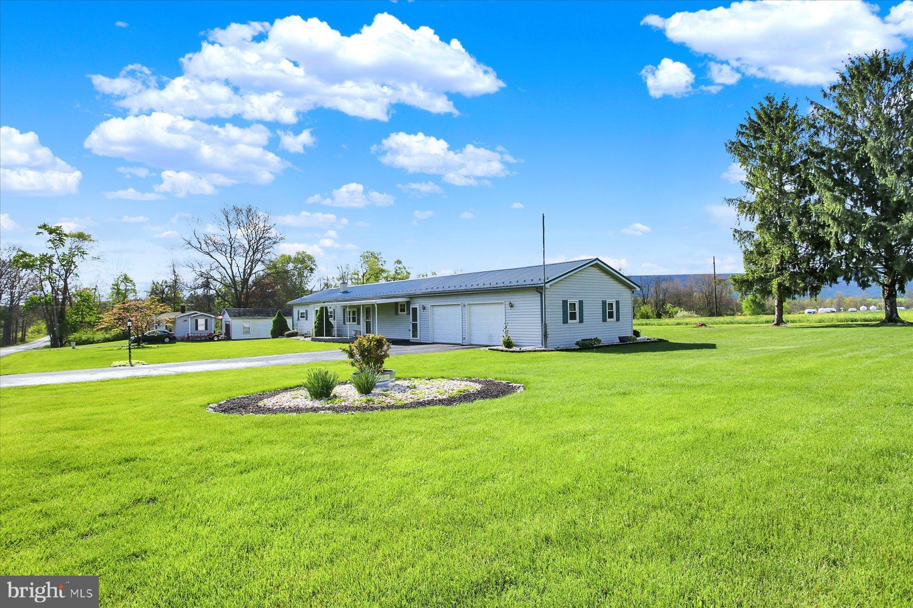 72 Cedar Grove Road Mifflintown, PA 17059 - Photo 30 of 31 a view of a house with a big yard and large trees