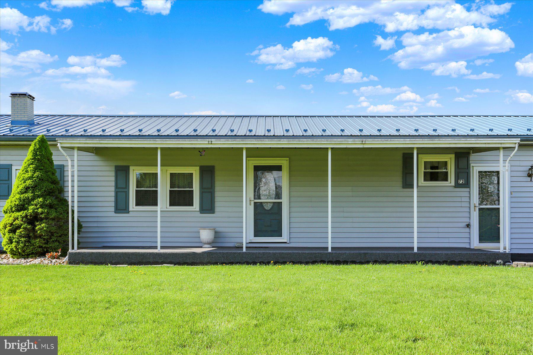72 Cedar Grove Road Mifflintown, PA 17059 - Photo 31 of 31 a front view of a house with a garden