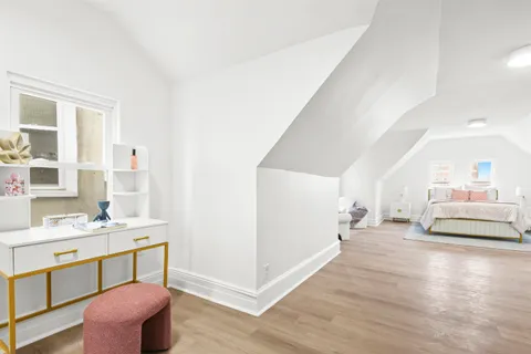 a view of a livingroom with furniture and wooden floor