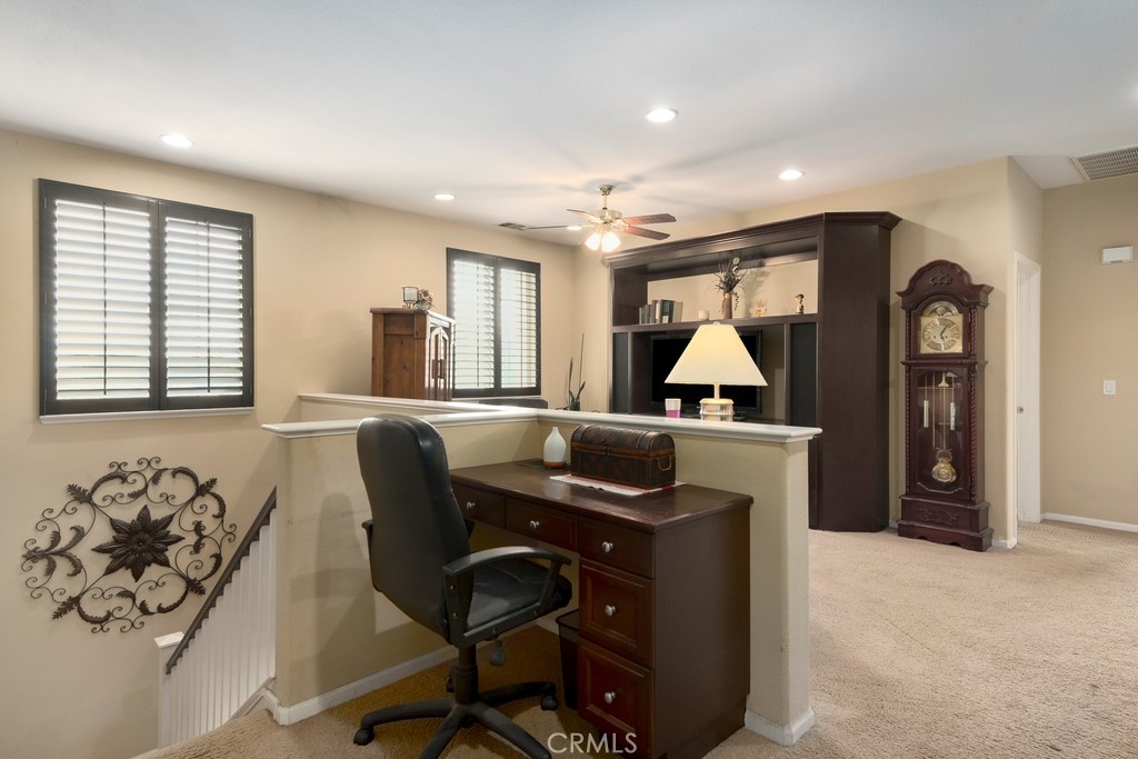 130 Daylily Drive Perris, CA 92571 - Photo 19 of 43 a workspace with furniture and window