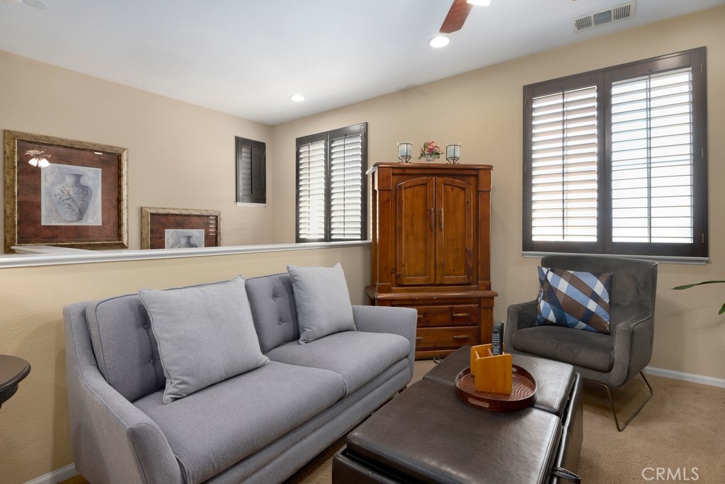 130 Daylily Drive Perris, CA 92571 - Photo 20 of 43 a living room with furniture and wooden floor