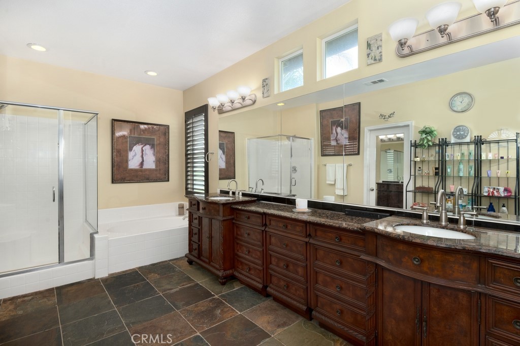 130 Daylily Drive Perris, CA 92571 - Photo 26 of 43 a spacious bathroom with double vanity and a bathtub