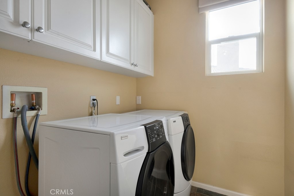 130 Daylily Drive Perris, CA 92571 - Photo 34 of 43 a utility room with dryer and washer