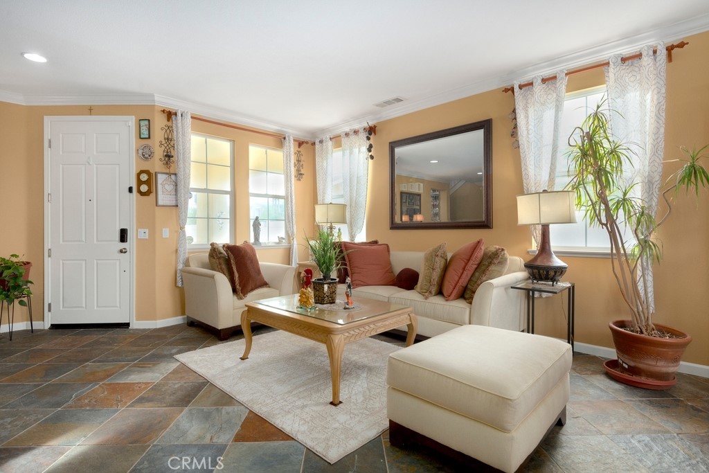 130 Daylily Drive Perris, CA 92571 - Photo 7 of 43 a living room with furniture and a large window