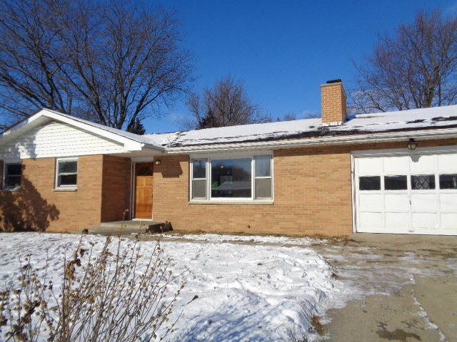 413 Phyllis Avenue Rochelle, IL 61068 - Photo 1 of 17 a front view of a house with a yard