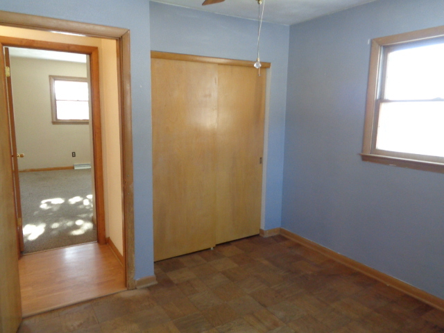 413 Phyllis Avenue Rochelle, IL 61068 - Photo 11 of 17 an empty room with windows and entrance