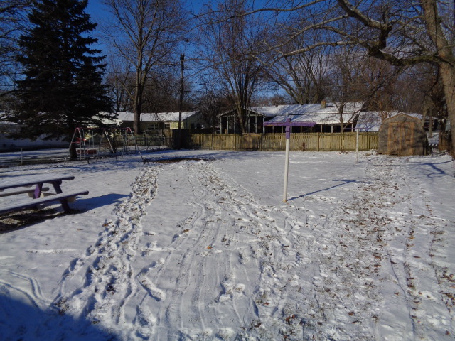 413 Phyllis Avenue Rochelle, IL 61068 - Photo 16 of 17 a view of a park with swings and a fire pit