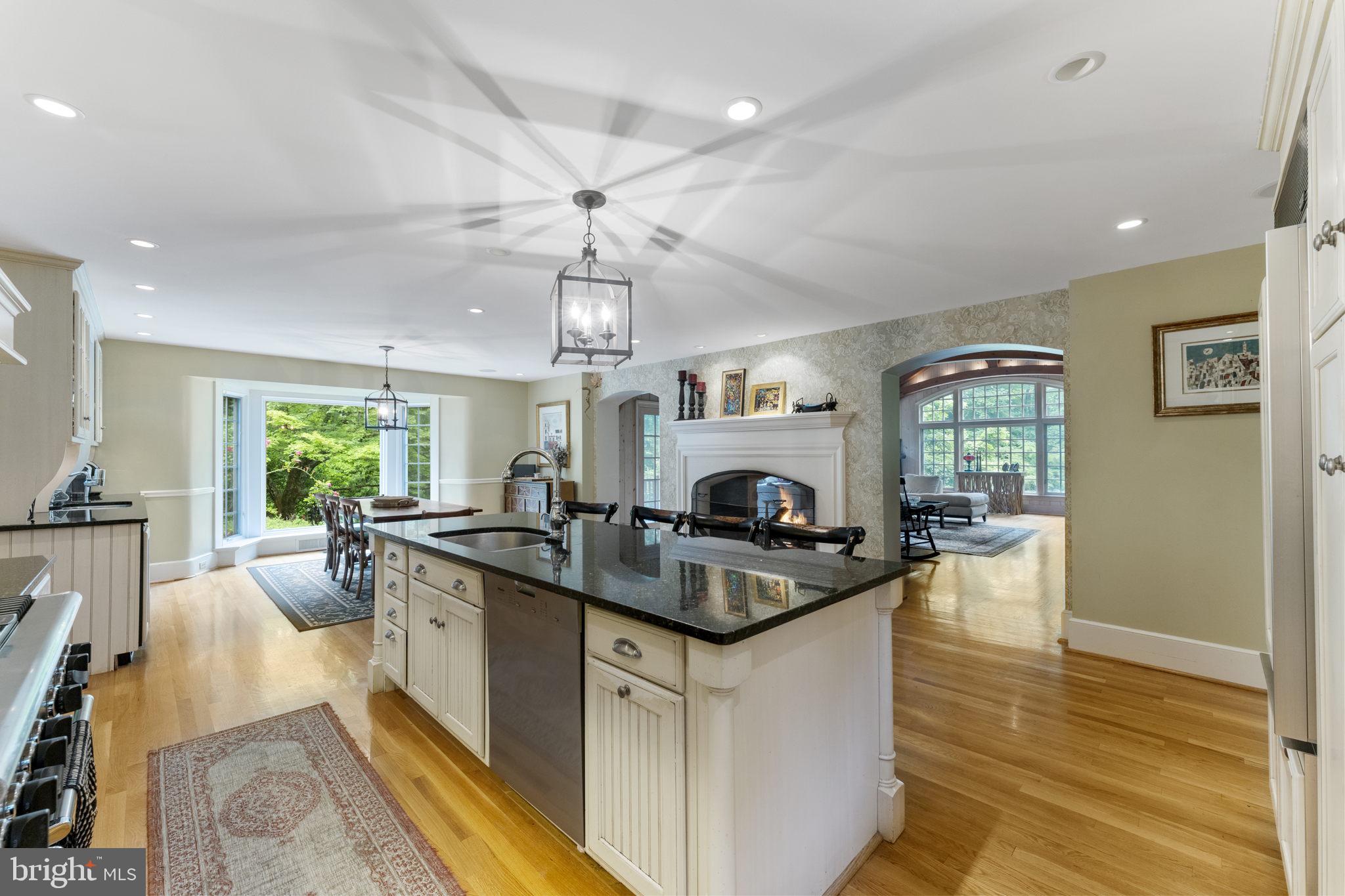569 County Line Road Wayne, PA 19087 - Photo 22 of 64 Fireside Kitchen with Double Sided Fireplace