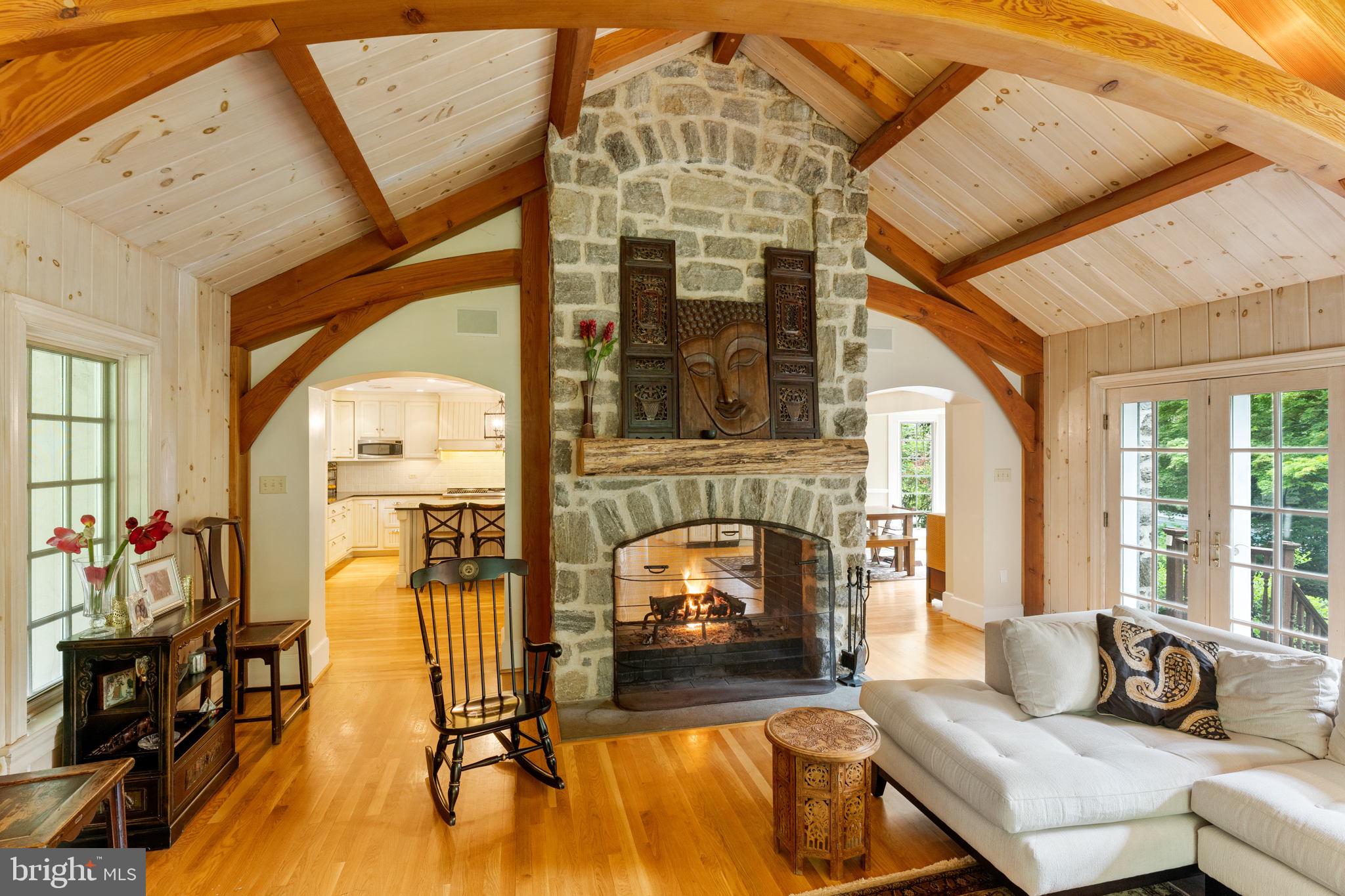 569 County Line Road Wayne, PA 19087 - Photo 27 of 64 With See Through Stone Double Sided Fireplace