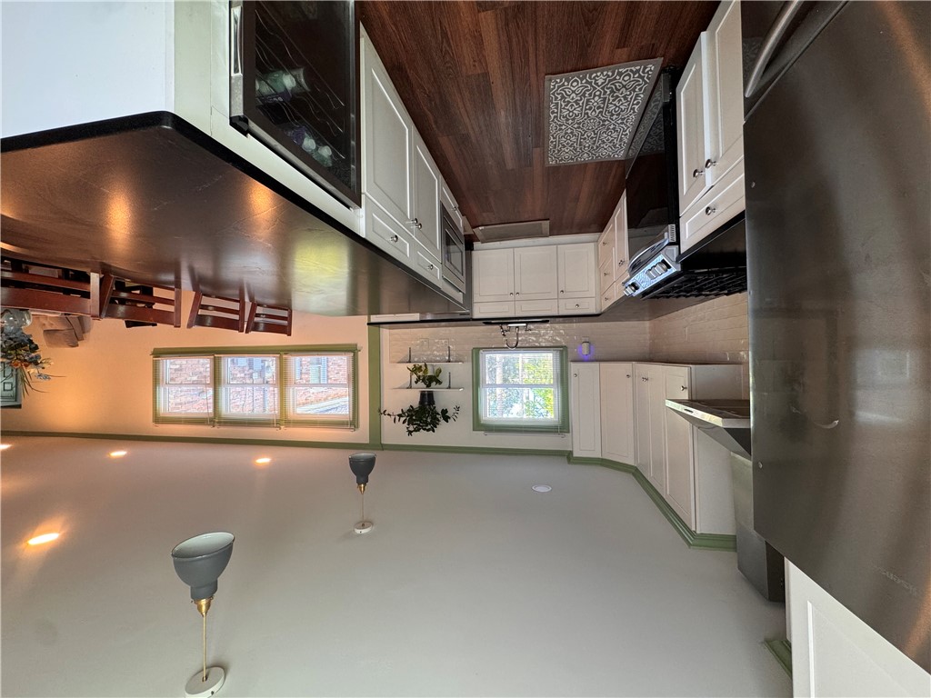 2211 East River Street Anderson, SC 29621 - Photo 20 of 40 This spacious kitchen offers ample counter space and seamless flow into the adjacent dining area.