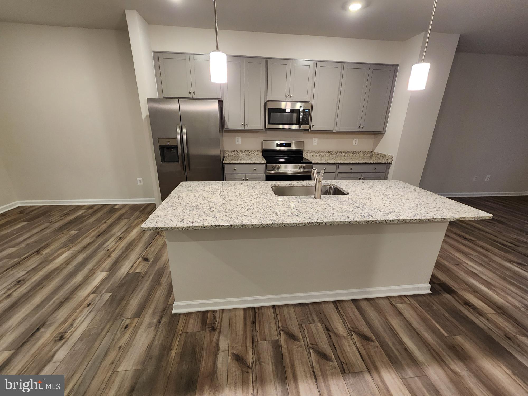 117 Canning Road Inwood, WV 25428 - Photo 11 of 41 a large kitchen with kitchen island sink refrigerator and stove