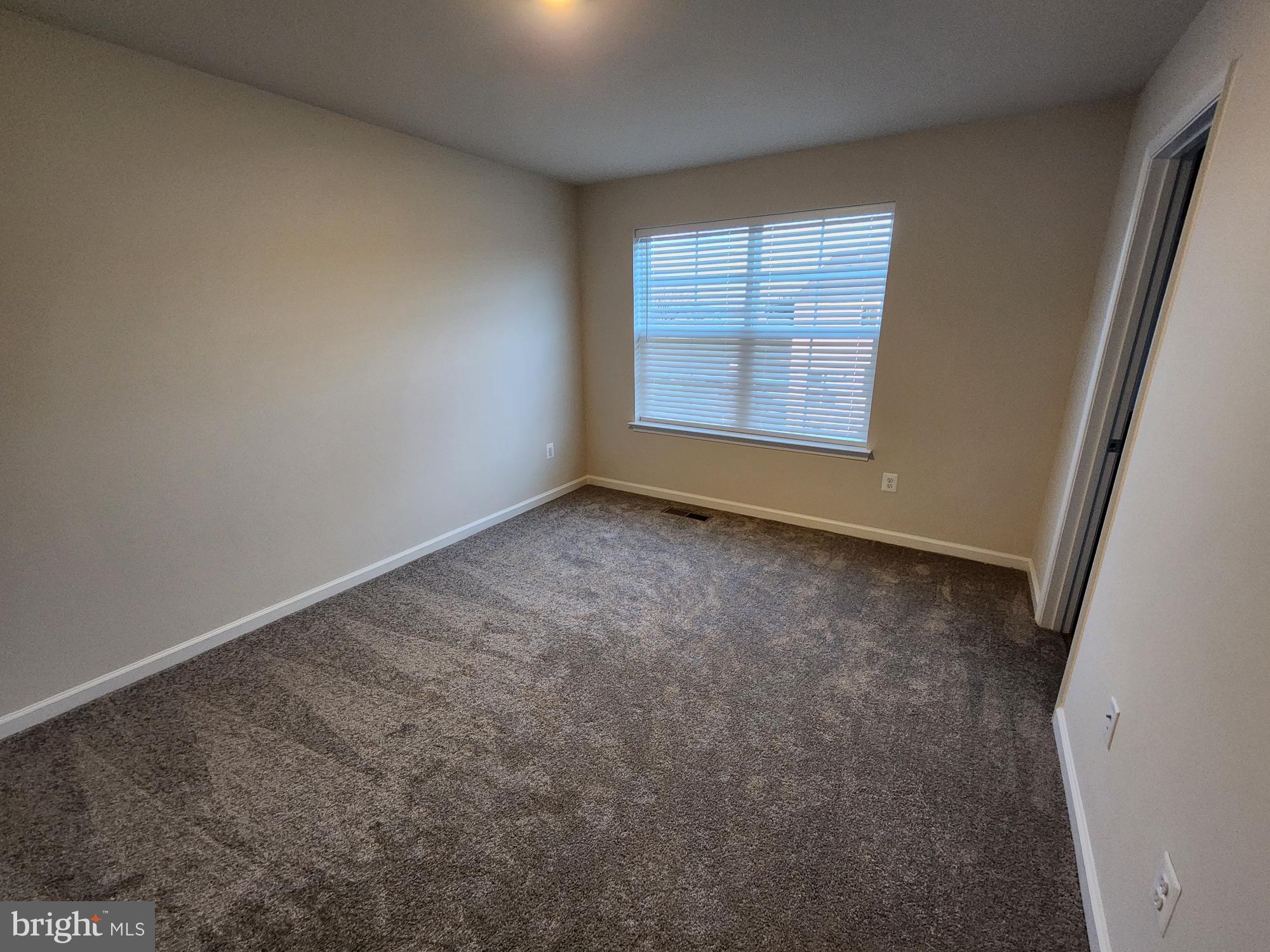 117 Canning Road Inwood, WV 25428 - Photo 20 of 41 an empty room with windows