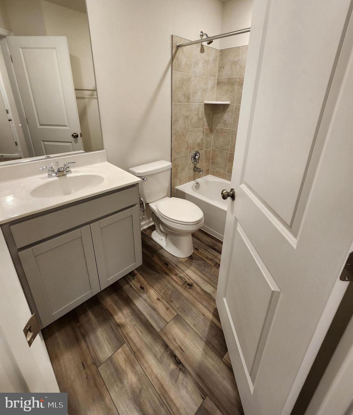 117 Canning Road Inwood, WV 25428 - Photo 28 of 41 a bathroom with a sink a toilet a mirror and shower