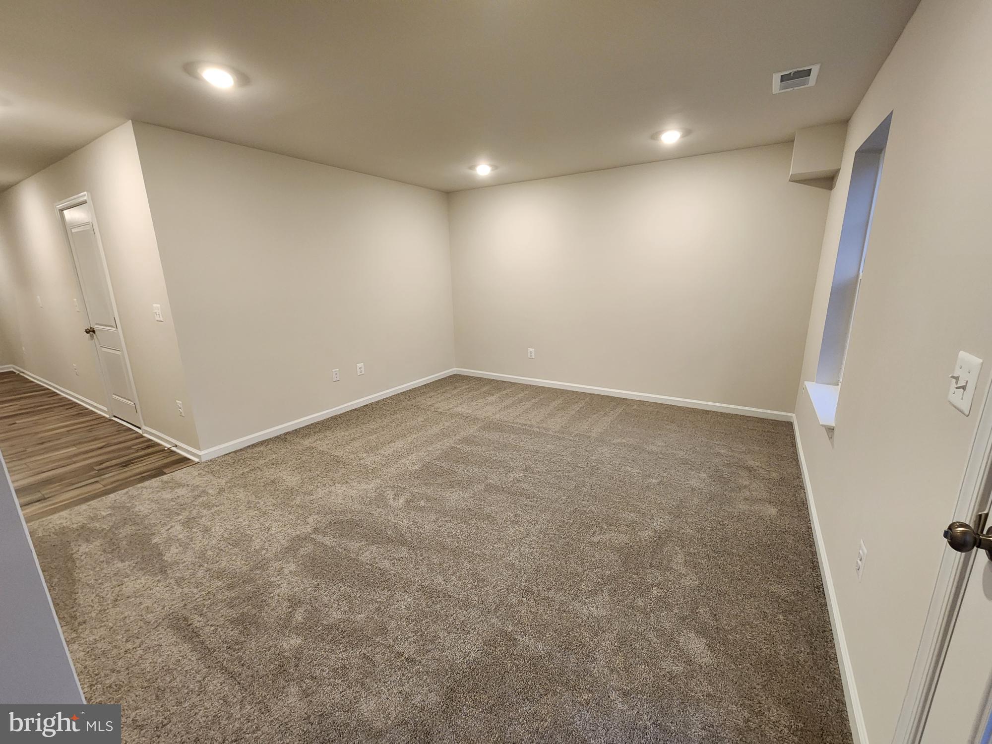 117 Canning Road Inwood, WV 25428 - Photo 34 of 41 wooden floor in an empty room with a window