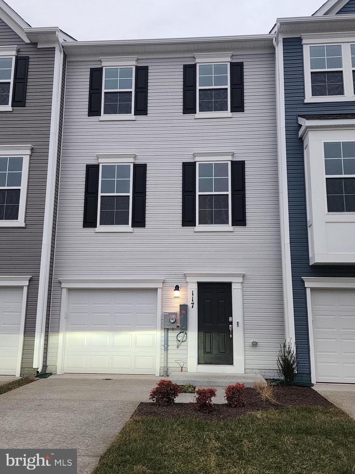 117 Canning Road Inwood, WV 25428 - Photo 38 of 41 a front view of a house with a yard and garage