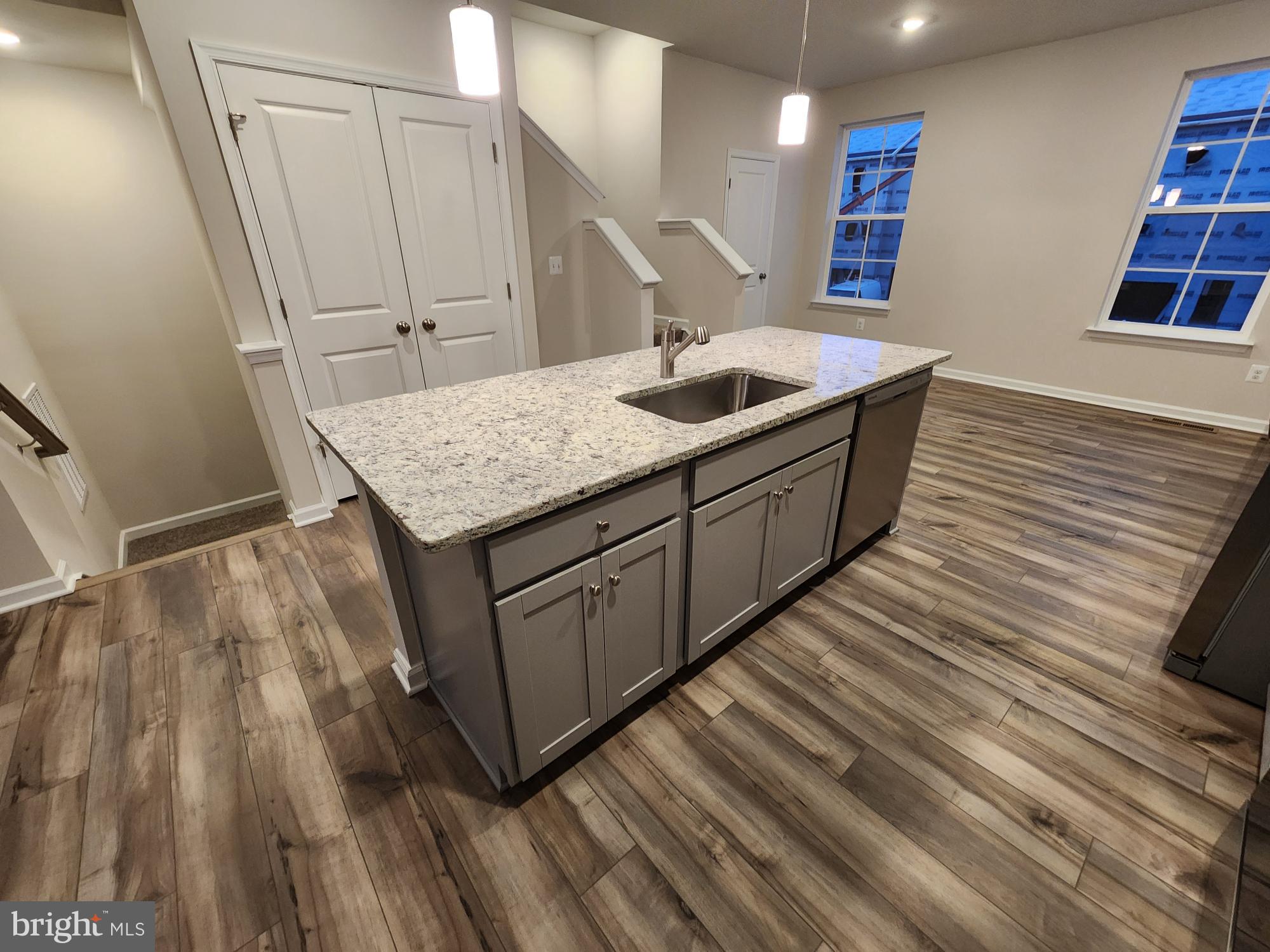 117 Canning Road Inwood, WV 25428 - Photo 9 of 41 a kitchen with a sink and wooden floor