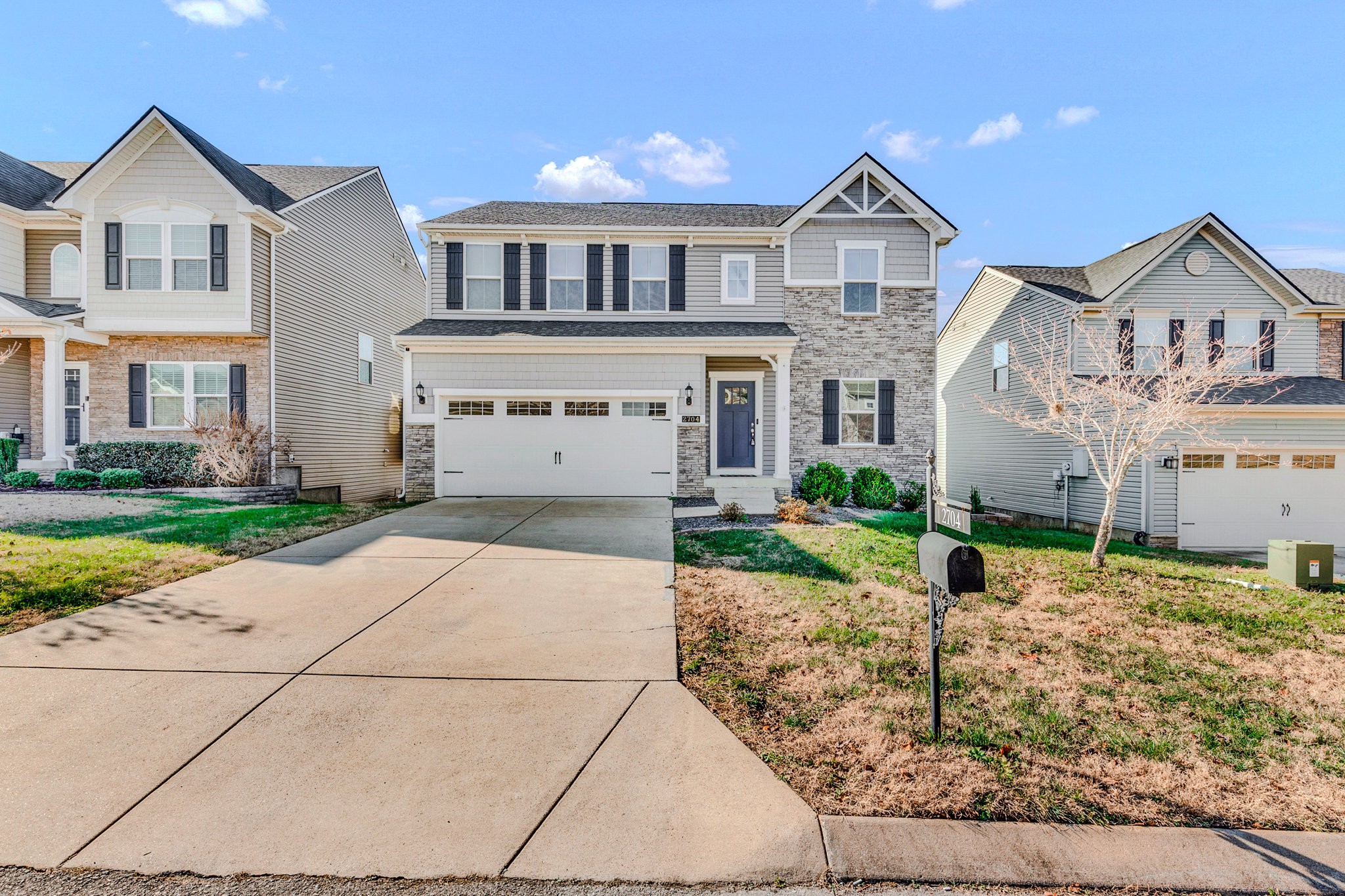 2704 Orleans Drive Columbia, TN 38401 - Photo 1 of 54 a front view of a house with a yard and garage