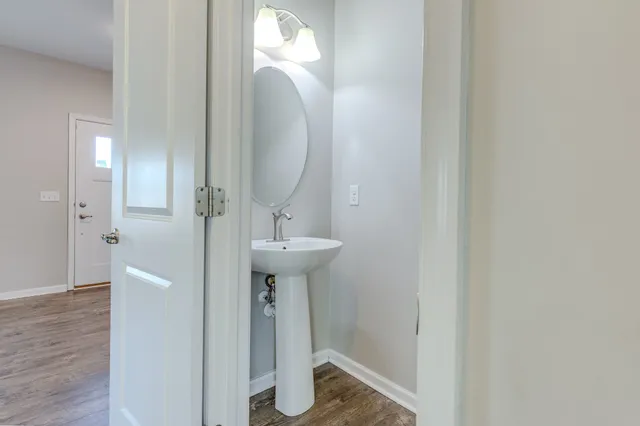 a bathroom with a sink and mirror