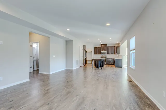 a view of kitchen with wooden floor