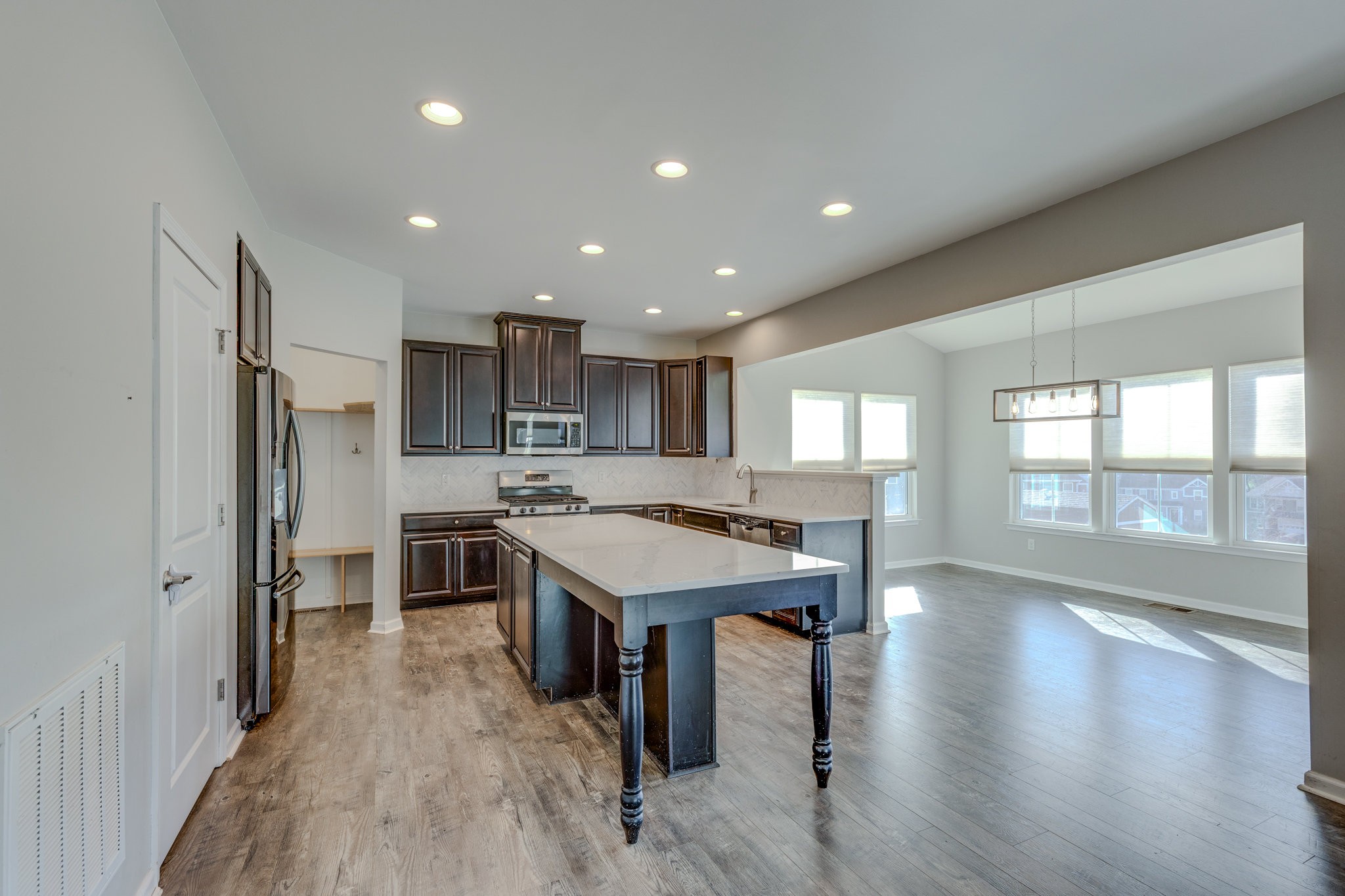 2704 Orleans Drive Columbia, TN 38401 - Photo 18 of 54 a large kitchen with a large window and stainless steel appliances