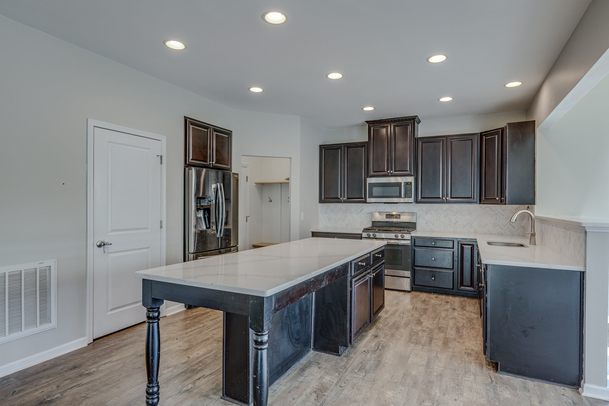 2704 Orleans Drive Columbia, TN 38401 - Photo 19 of 54 a kitchen with stainless steel appliances granite countertop a sink stove and refrigerator