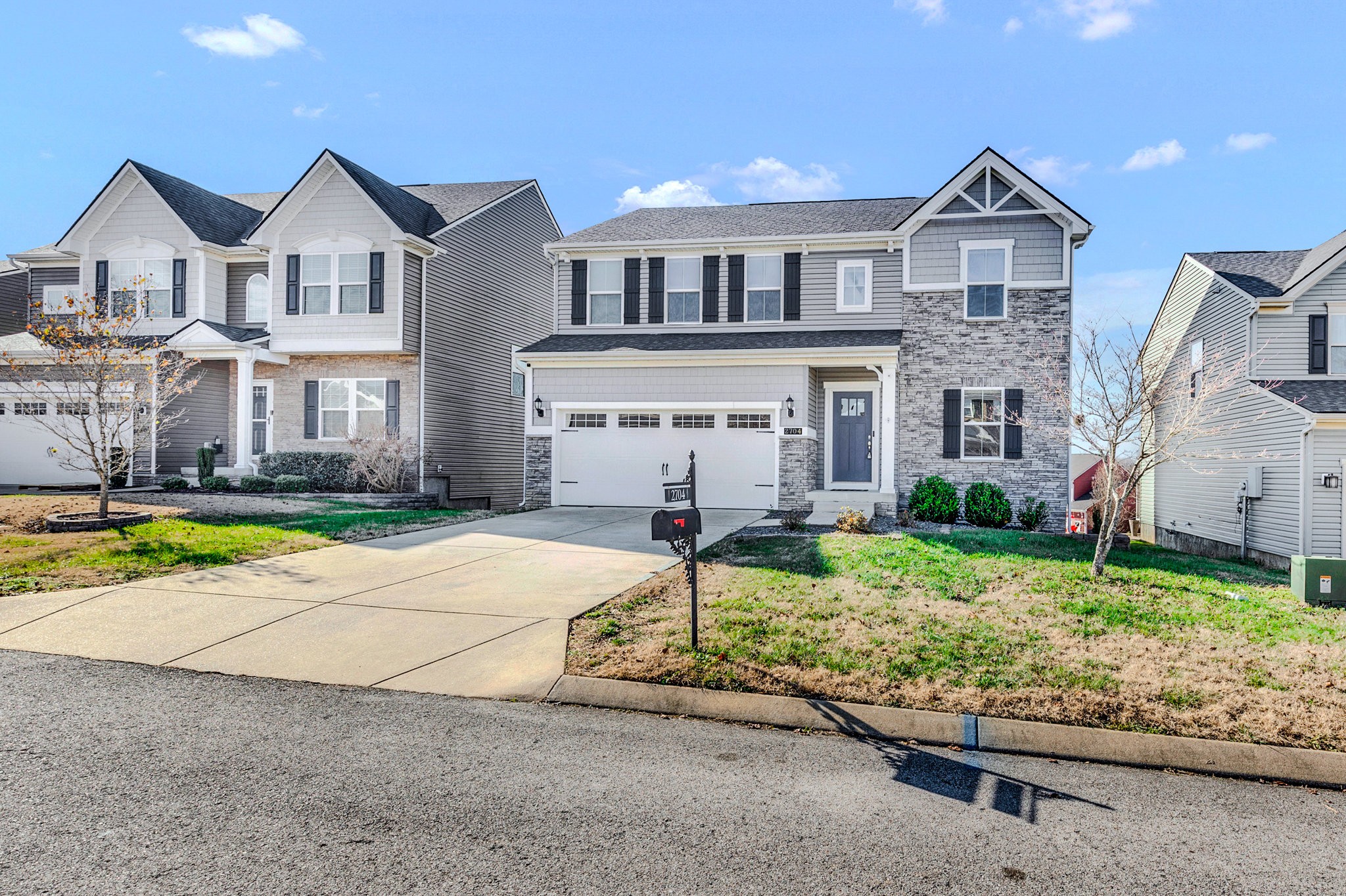2704 Orleans Drive Columbia, TN 38401 - Photo 2 of 54 a front view of a house with a yard and potted plants