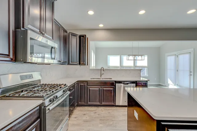 a kitchen with a stove and a sink