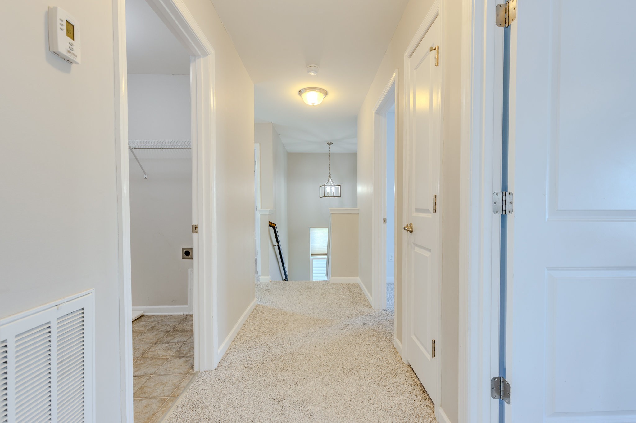 2704 Orleans Drive Columbia, TN 38401 - Photo 26 of 54 a view of a hallway with wooden floor and a bathroom