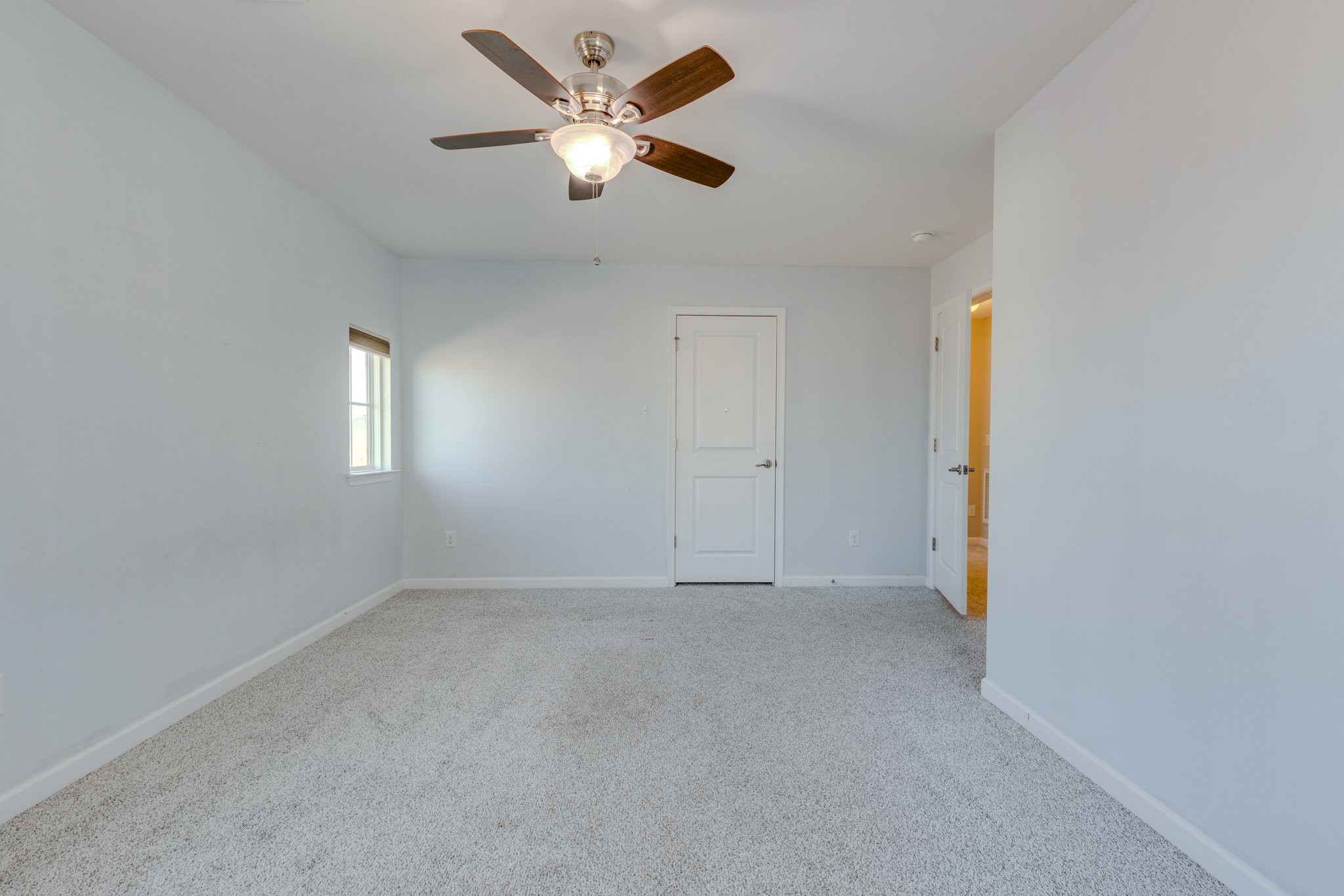 2704 Orleans Drive Columbia, TN 38401 - Photo 32 of 54 an empty room with a window and a fan