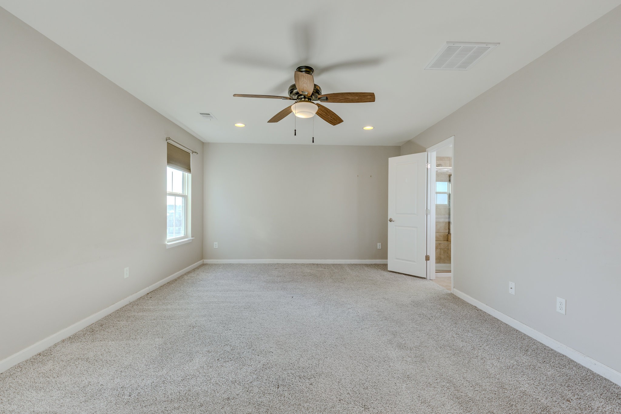 2704 Orleans Drive Columbia, TN 38401 - Photo 37 of 54 an empty room with chandelier fan and windows