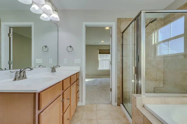a view of empty room with wooden floor and ceiling fan