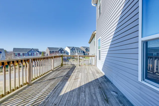 a view of balcony with deck and wooden floor