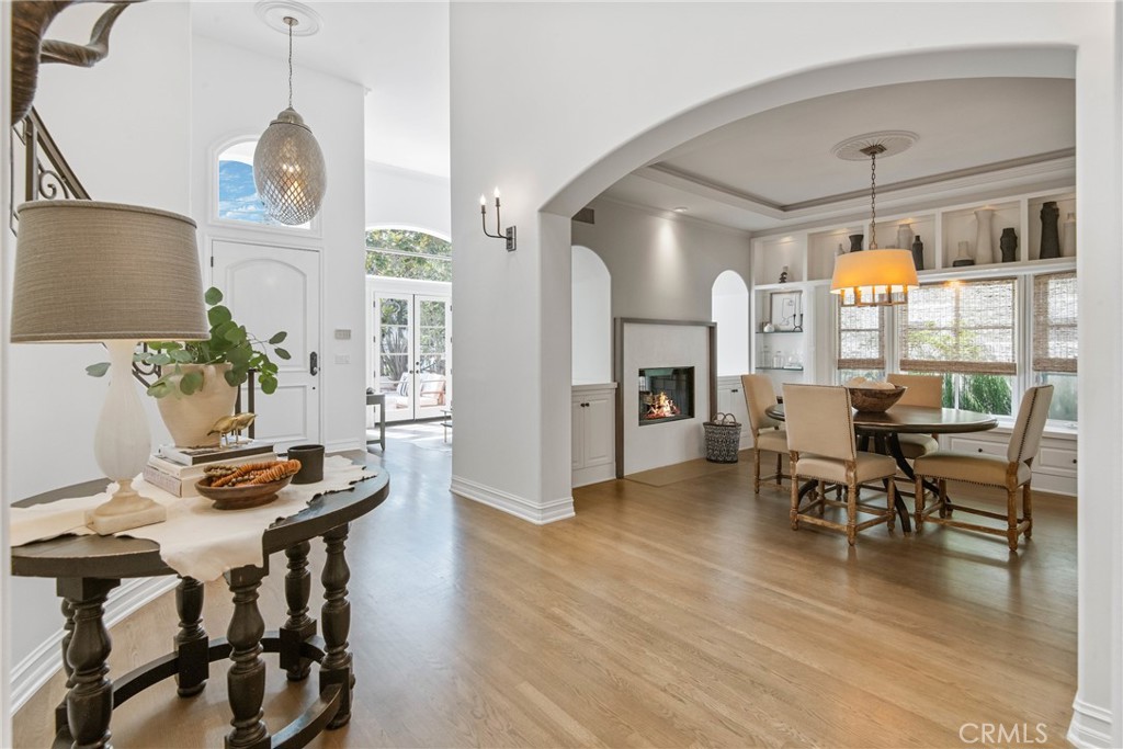 1427 Eighth Street Manhattan Beach, CA 90266 - Photo 26 of 47 a dining room with furniture a chandelier and wooden floor