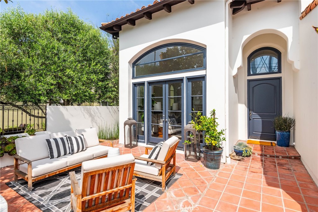 1427 Eighth Street Manhattan Beach, CA 90266 - Photo 3 of 47 a view of a patio with couches table and chairs and potted plants