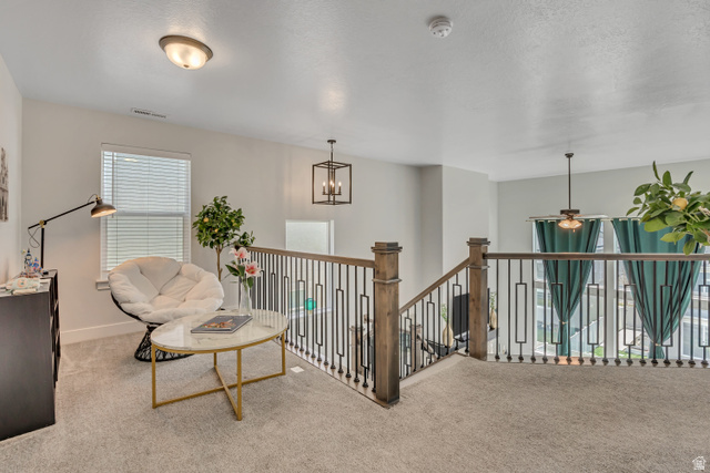 1577 Quailhill Road Saratoga Springs, UT 84045 - Photo 17 of 46 Sitting room featuring carpet, an upstairs landing, and a ceiling fan