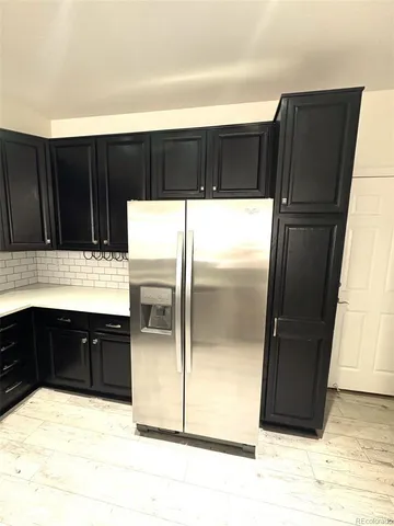 a kitchen with a refrigerator