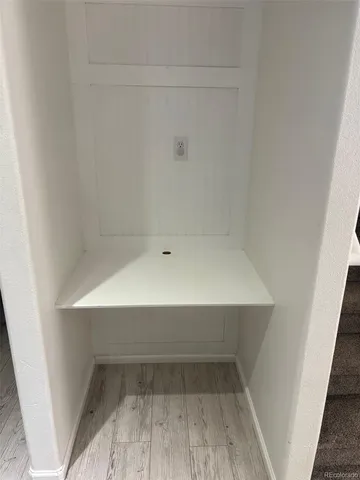 a view of an empty room with gym equipment