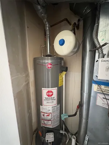 a view of yard with large tree and wooden fence