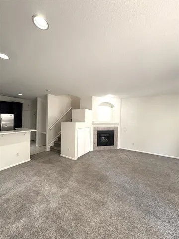 a view of kitchen with white cabinets