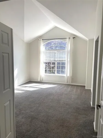 an empty room with a fireplace