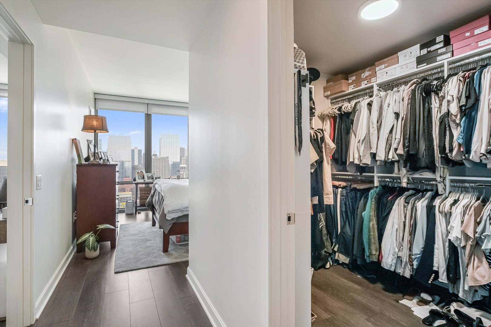 164 North Peoria Street, Unit 4004 Chicago, IL 60607 - Photo 15 of 32 a view of walk in closet with clothes and shoes