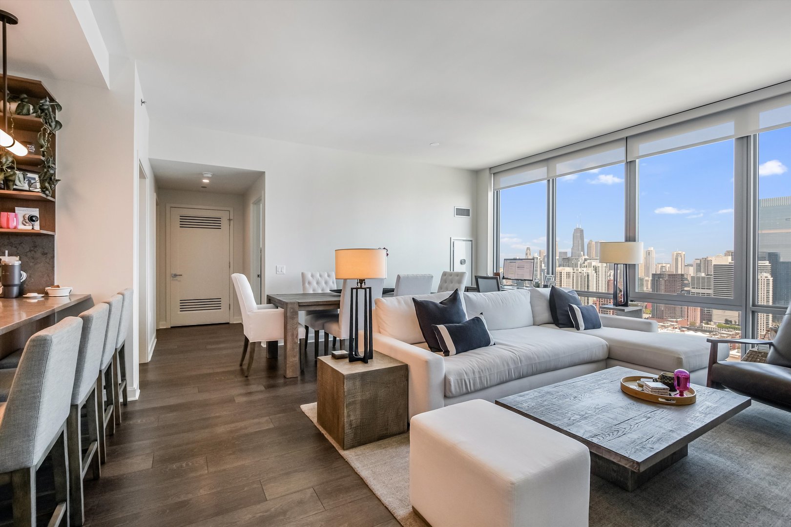 164 North Peoria Street, Unit 4004 Chicago, IL 60607 - Photo 2 of 32 a living room with furniture and a table
