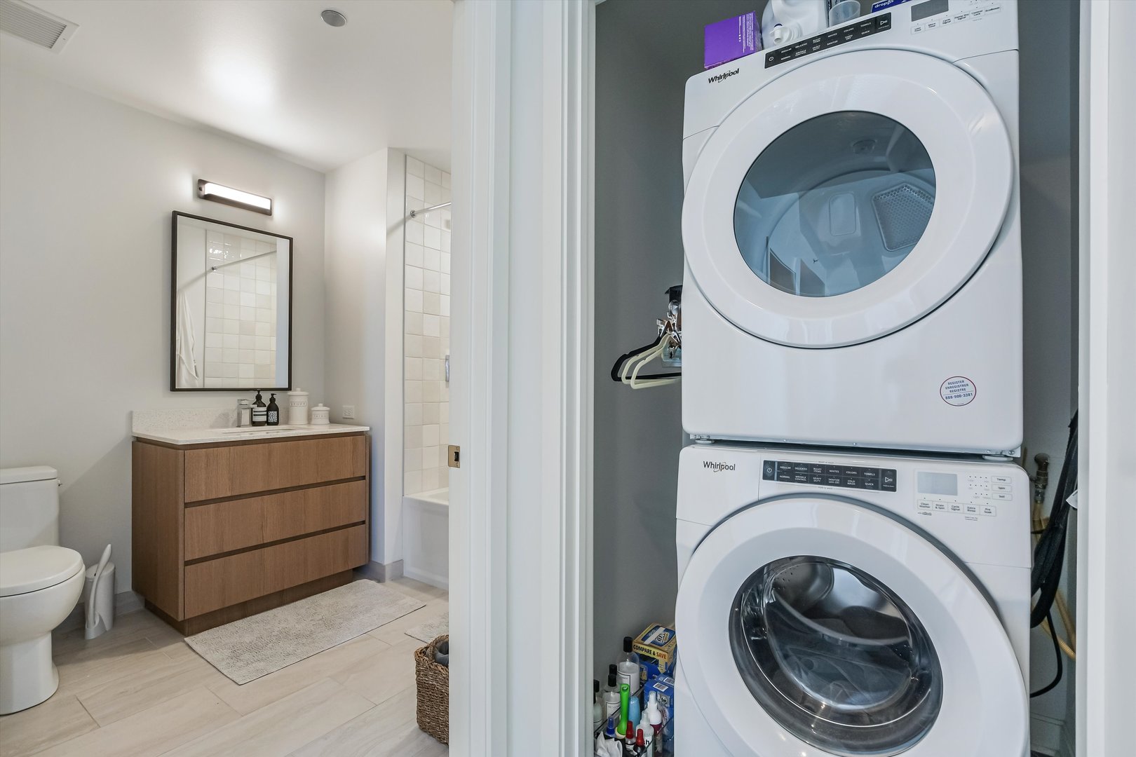 164 North Peoria Street, Unit 4004 Chicago, IL 60607 - Photo 22 of 32 a view of a hallway with washer and dryer